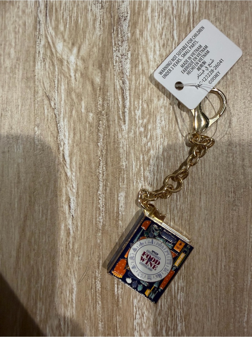 Disney Epcot food and wine Charm Keychain with Blue, Orange, Cream Accents
